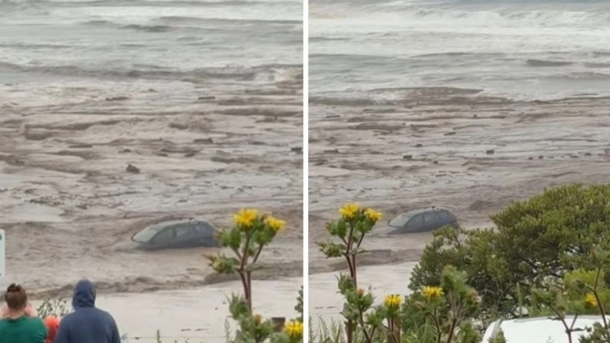 Stâlp de electricitate căzut și noroi pe un drum din Victoria după furtună